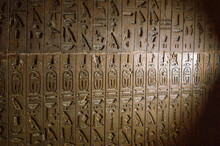 Wall Carved With Ancient Egyptian Hieroglyphs In Repeated Pattern Inside A Pyramid In Giza, Cairo, Egypt
