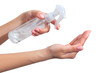 © Саша Потапов - Hand disinfection. Lady's hand takes alcohol disinfectant spray on her hands. to prevent a viral epidemic. Isolated on a white background. Flu Prevention Properly clean and disinfect hands.