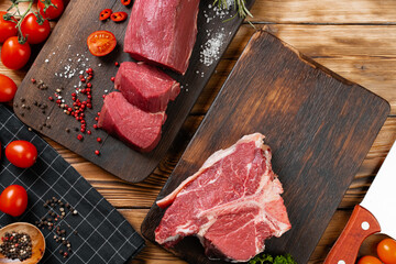 Wall Mural - Slices raw meat fillet on wooden board