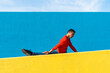© VISTA by Westend61 - Young dancer stretching on yellow wall