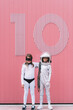 © VISTA by Westend61 - Two kids in astronaut and superhero costumes