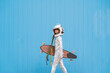 © VISTA by Westend61 - Kid dressed as an astronaut with longboard