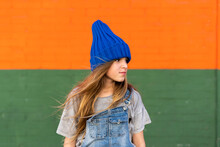 Portrait Of Young Girl With Blue Woolly Hat