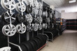 Car tires and alloy wheels on rack in auto store