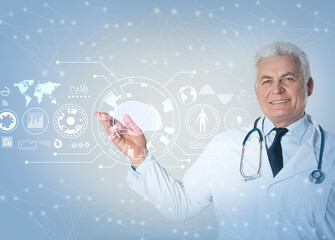Senior doctor demonstrating machine learning model on light background