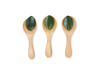 Wall Mural - Wooden eating spoon set Environmentally friendly with leaves isolated on white background.