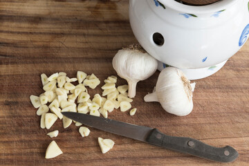 chopping garlic in the kitchen