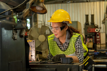 Poster - Female technician working on project in a factory,Industrial building concept.