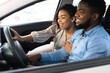 © Prostock-studio - Cheerful Black Couple Testing Car Buying Auto In Dealership Center