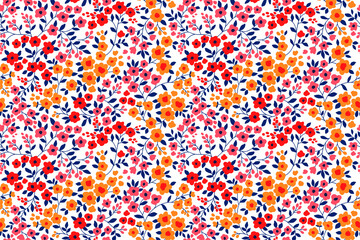 Floral pattern. Pretty flowers on white background. Printing with small orange, red and pink flowers. Ditsy print. Seamless vector texture. Spring bouquet.