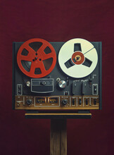Retro Reel To Reel Tape Player, On A Red Background