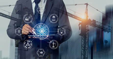 Double exposure engineering using digital technology interfaces icon with construction cranes no city background.