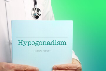 Wall Mural - Hypogonadism. Doctor (male) with stethoscope holds medical report in his hands. Cutout. Green turquoise background. Text is on the documents. Healthcare/Medicine