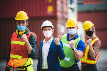 Wall Mural - worker group with engineer, foreman, and manager are wearing medical protection face mask in industry working site, working measures to prevent the spread of the virus COVID-19