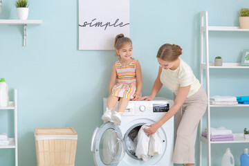 Sticker - Mother and little daughter doing laundry at home