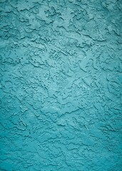 Vertical shot of the textures and patterns of a wall with nice blue paint