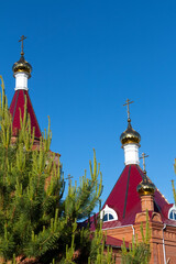 Golden cross on the dome of an Orthodox church close-up.