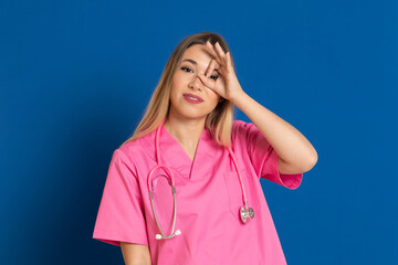 Blonde doctor with pink uniform