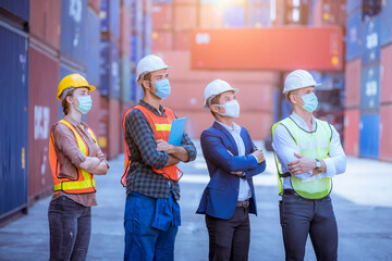 Portrait dock worker and engineer under inspection and checking production wearing safety uniform with mask to protect for pollution ,virus in dock container warehouse.