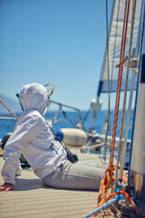 Wall Mural - Summertime cruising and enjoying on a sailing boat at open sea.