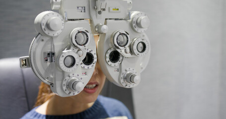 Wall Mural - Woman check her eye at clinic