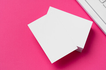 Sticker - Blank business cards with supplies and keyboard on office table.