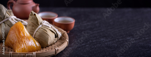 Cuadros en Lienzo Alkaline rice dumpling zongzi - Traditional sweet Chinese crystal food on a plate to eat for Dragon Boat Duanwu Festival celebration concept, close up