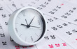 © splitov27 - White clock on a monthly calendar.