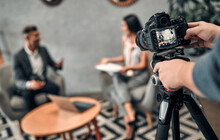 Female Journalist Interviewing Business Man