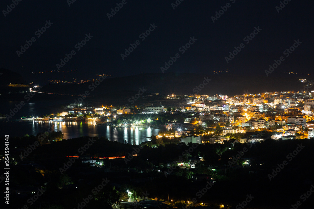 Aerial view of night town from Hill after sunset - modern city with spectacular nightscape panorama. aerial view, night city with night sky. natural summer night. horizontal