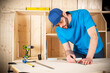 © stockphoto-graf - young male carpenter with beard pencil and stop angle meter at work. measuring wood plank  woodworking construction tool concept furniture making diy background
