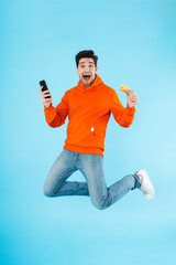 Canvas Print - Portrait of a cheerful young man wearing hoodie