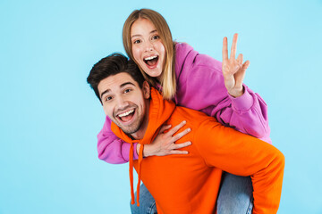 Wall Mural - Portrait of a young couple wearing hoodies