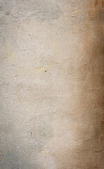 Wall Mural - Concrete wall texture with subtle coloration variations in tan, gray, and brown shades, vertical aspect