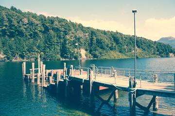 Sticker - Lake pier in New Zealand. Vintage filter toned color image.