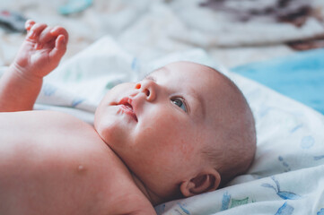 portrait of a little boy. cute baby. three month old boy smiling. baby with a pacifier