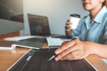 developing concentrated programmer reading computer codes development website design and coding tech