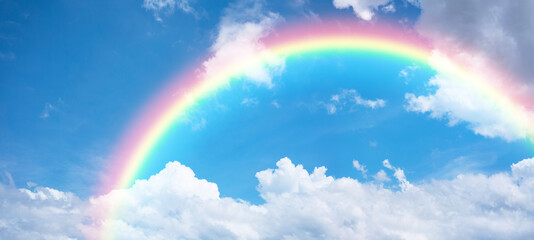 rainbow in blue sky.