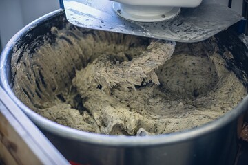 Sticker - Closeup shot of the dough being mixed in the machine