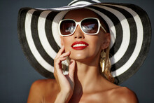 Elegant Beautiful Woman With Perfect Skin In Hat And Sunglasses - Close Up