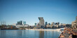 Panorama view on Oslo downtown. Sunny summer day, people enjoying sun, view on Oslo Opera House, sea and new Munch museum.