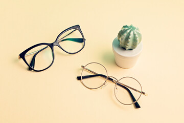 Sticker - Stylish eyeglasses over pastel  background. Optical store, glasses selection, eye test, vision examination at optician, fashion accessories concept