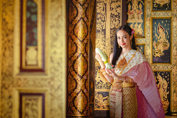 Wall Mural - Thai girl in traditional thai costume, identity culture of Thailand.
