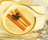 Moning coffee in luxury white cup with cinnamon sticks and star anise.Beautiful warm scene cozy home breakfast with lavander.Cup of Specialty Coffee beverage.Top view