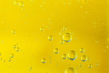 Golden Yellow Bubble Oil Or Serum, Abstract Yellow Water Bubbles Background