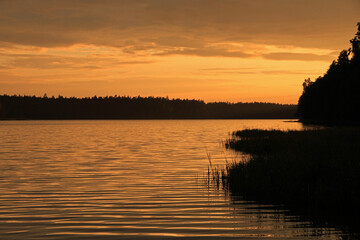 Sunset over Mikaszewo lake in Augustow Primeval Forest, Suwalki Region in Poland