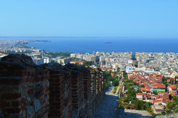 Thessaloniki city panoramic view from the hill with 
castle walls and Aegean Sea
