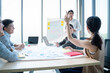 © Yingyaipumi - Group of Asian and caucasian young business people team meeting and great success emotion teamwork people business startup office background,working,planning,brainstorm meeting and ideas concept