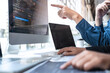 © Ngampol - Professional Developer programmer cooperation meeting and brainstorming and programming in website working a software outsourcing and coding technology, writing codes and database