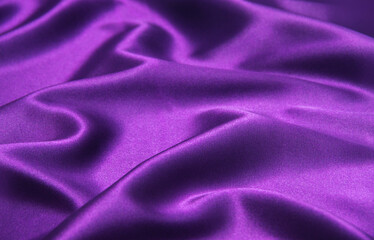 Closeup of rippled purple silk fabric